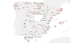 Mapa de España con estrellas Michelin y un cuadro de diálogo de restaurante.