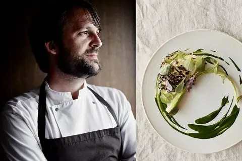 El chef con barba, posible mejor cocinero del mundo, mira a un lado de un plato con un delicado plato de verduras y salsa verde.