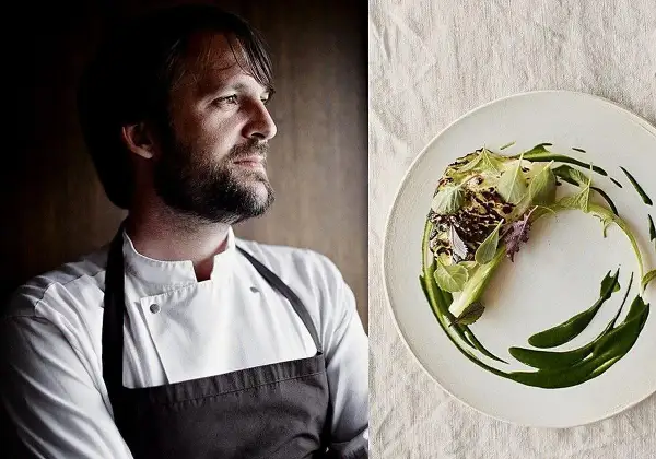El chef con barba, posible mejor cocinero del mundo, mira a un lado de un plato con un delicado plato de verduras y salsa verde.